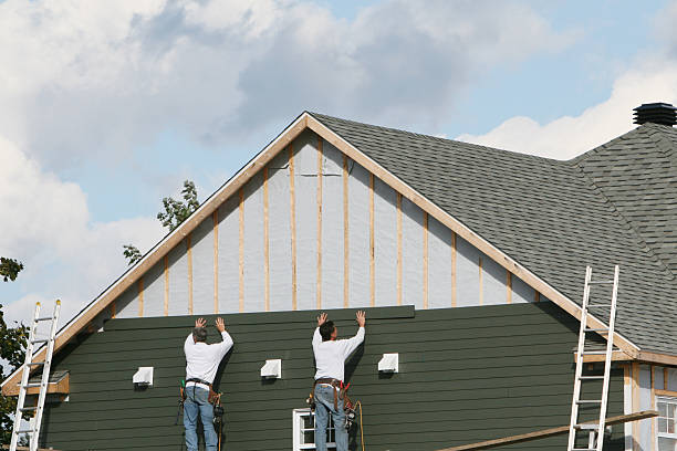 Professional Siding technician working in Lewisville, OH